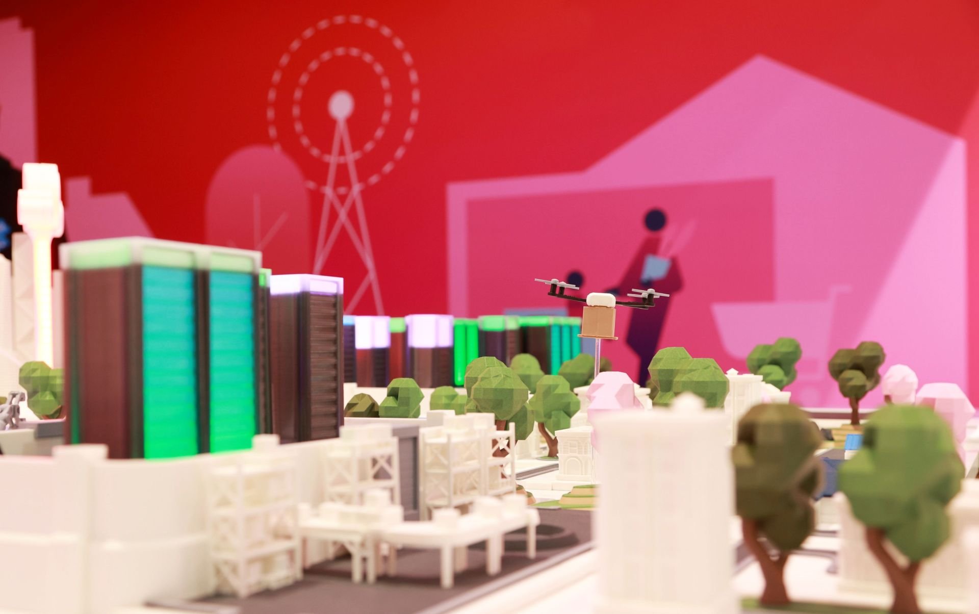 Close-up from the digital twin of the product that shows 3D printed city with colorful buildings and trees.