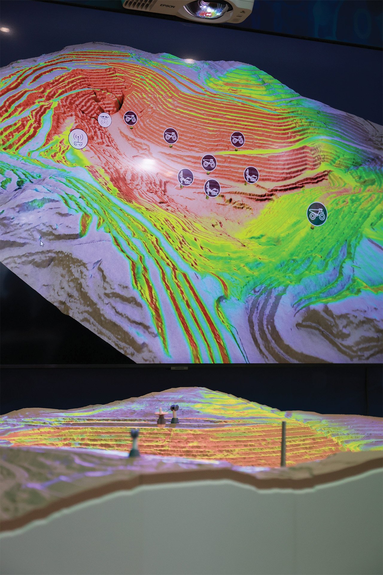 An image of a digital twin that is 3D-printed scale model with an interactive landscape projected onto it.