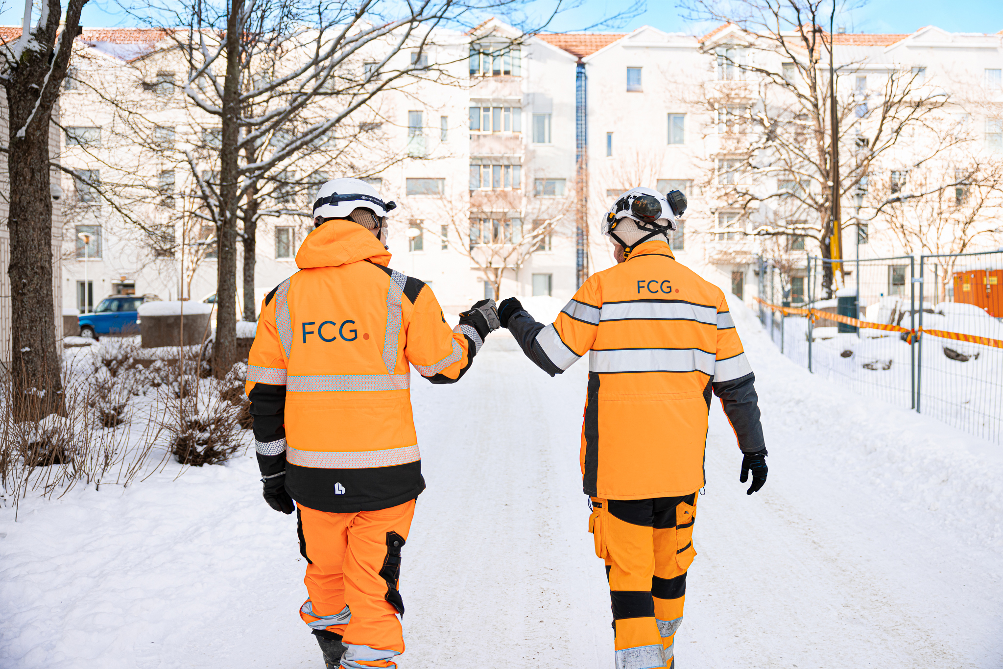 two FCG workers fist pumping